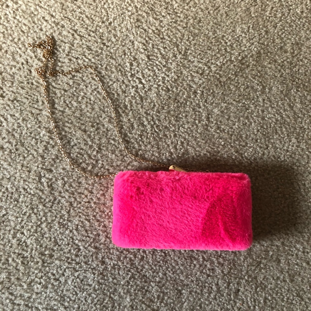 Furry pink clutch